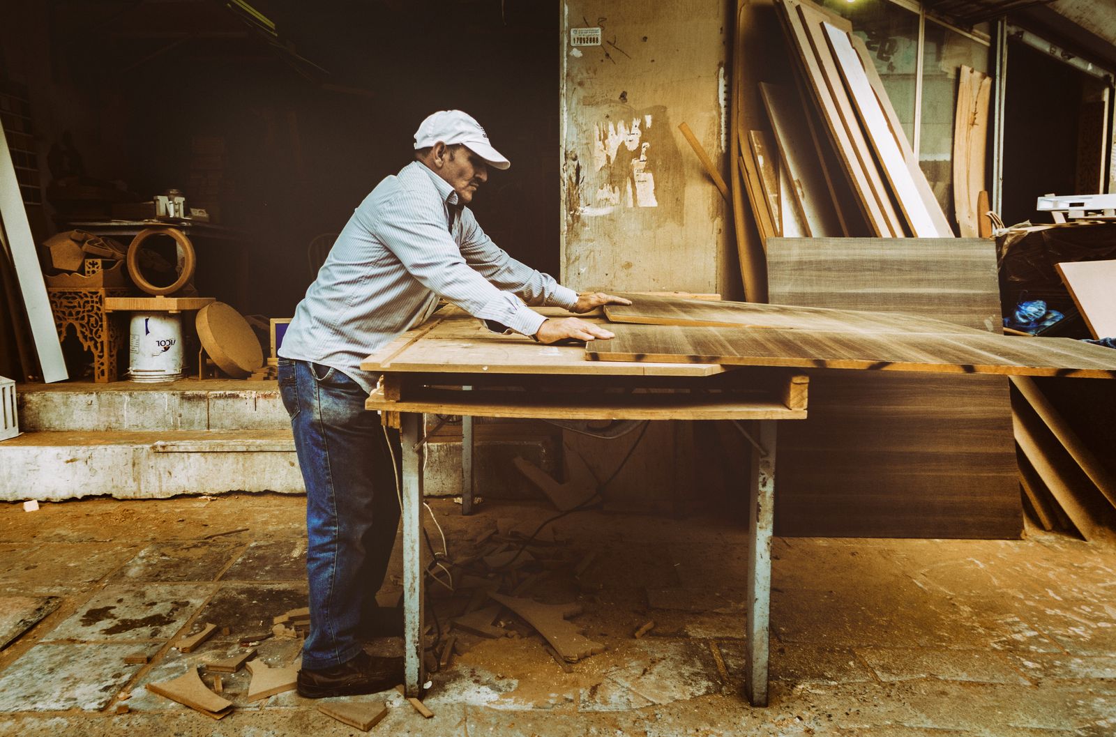 Carpenter focused on a woodworking project in a workshop
