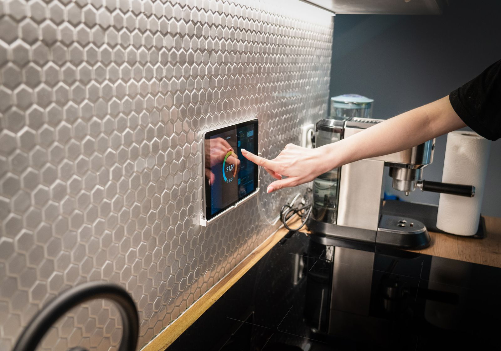 Modern kitchen with a touchscreen smart home control panel