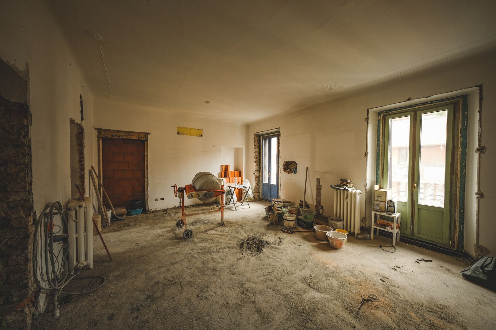 Sunny room under renovation with construction materials