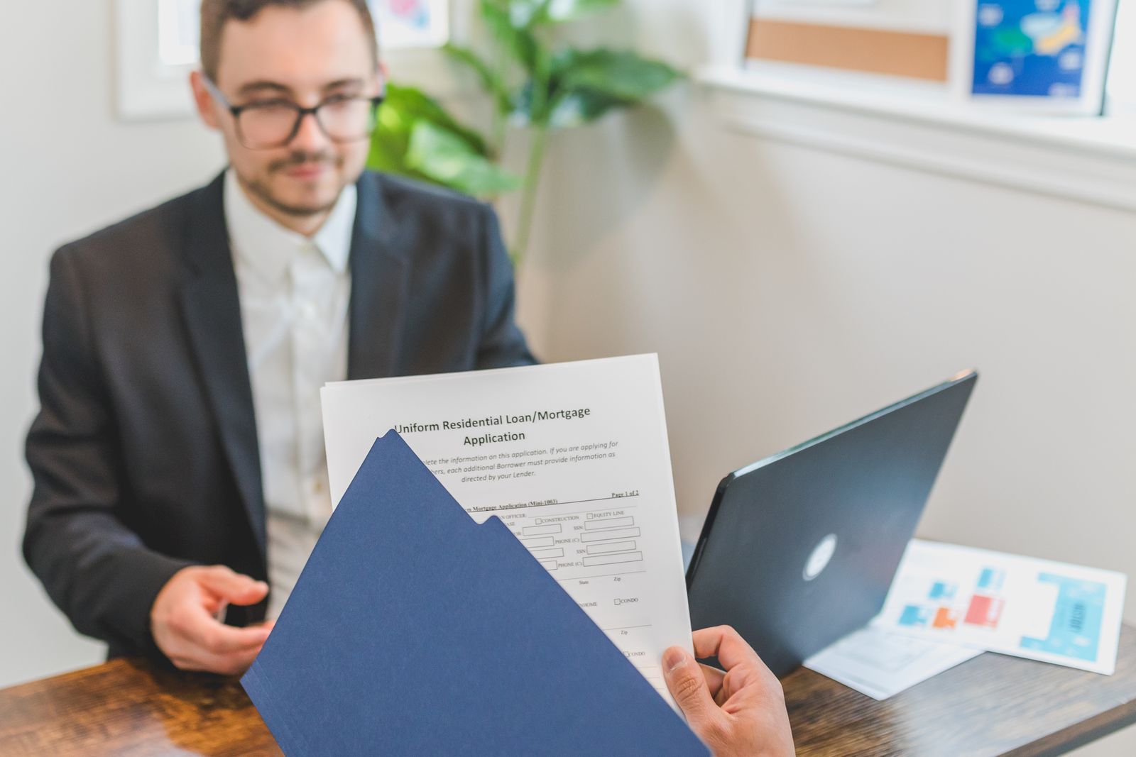 Mortgage broker and client discussing a loan application