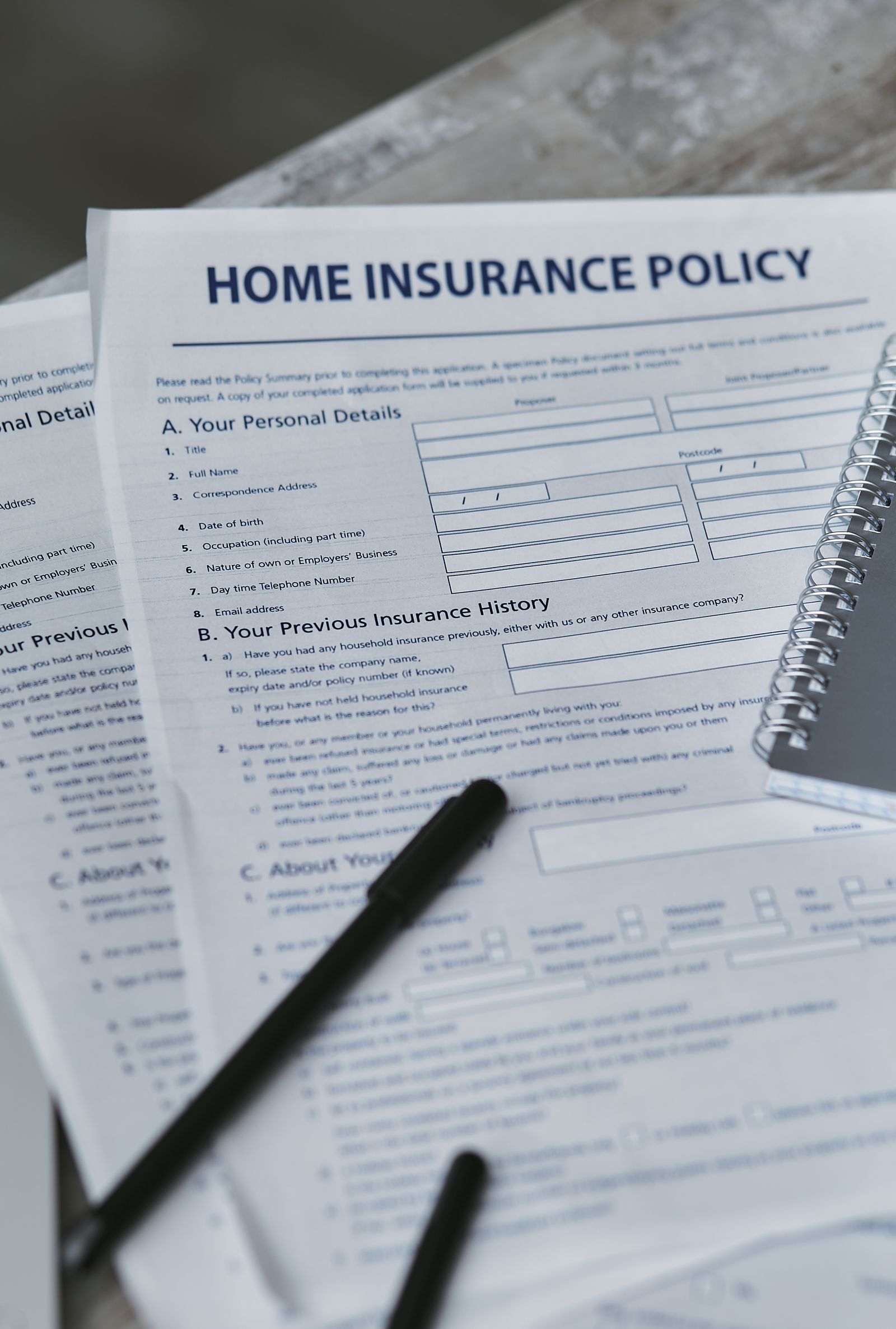 Home insurance policy form and notebook