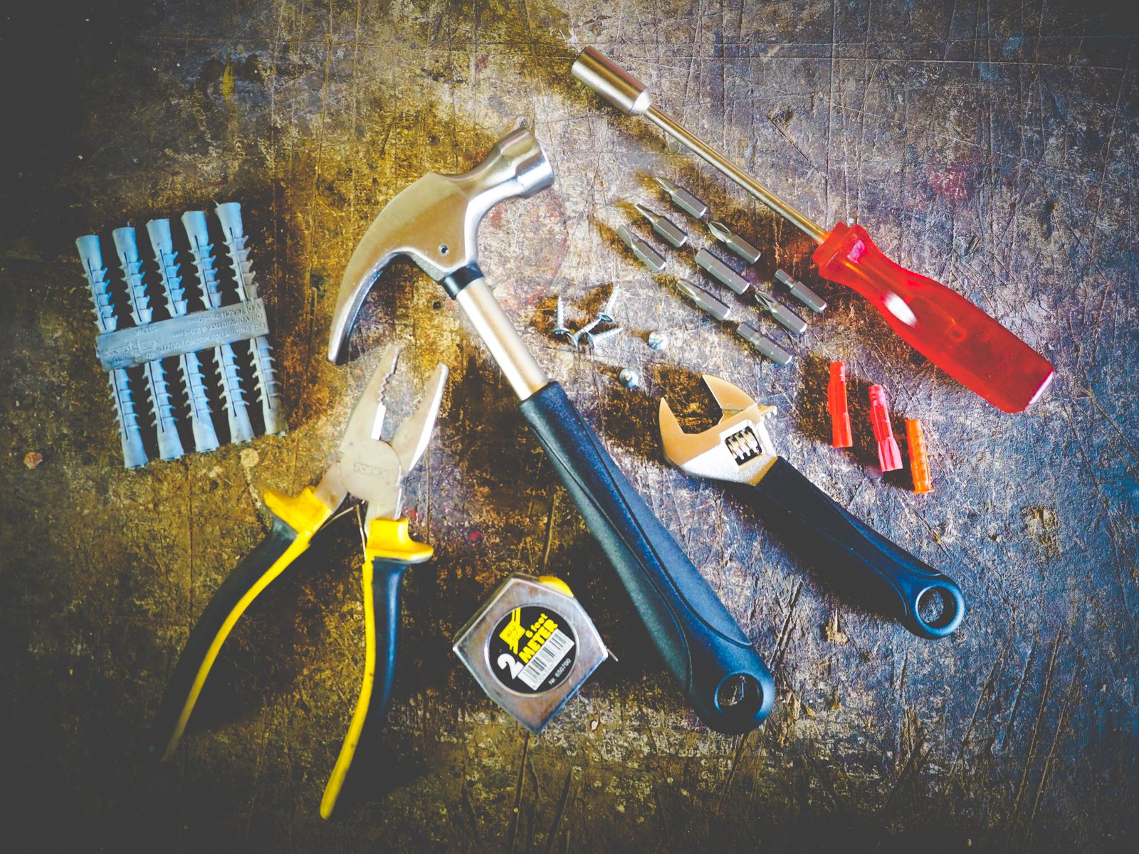 Collection of hand tools including hammer and screwdriver